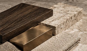 Concept of material samples: dark oak, travertine, a bronze plate and woven fabric